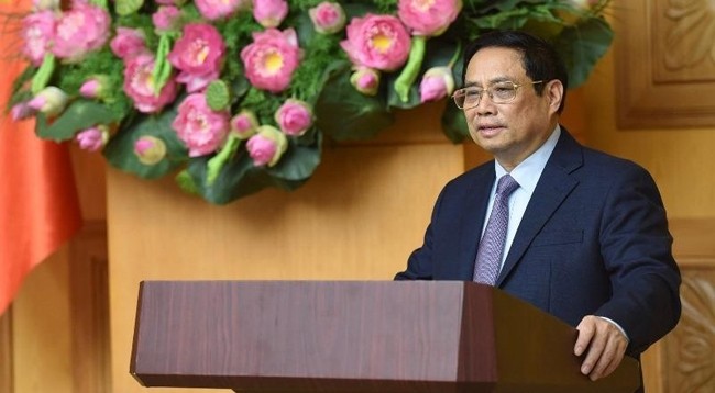 Премьер-министр Фам Минь Тьинь выступает на диалоге. Фото: Чан Хай